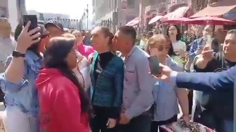 Man tries to kiss, touch Mexico President Claudia Sheinbaum during public greeting.