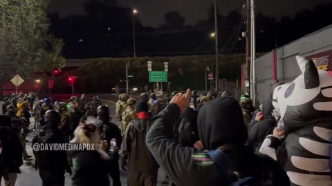 JUST IN- Federal officers rush rioters outside of the Portland ICE facility and make two arrests._