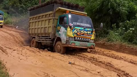 The truck passed through a pothole full of mud