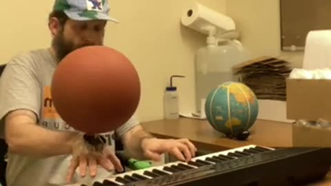 Playing Game Soundtrack On Piano While Spinning Basketball On Hand