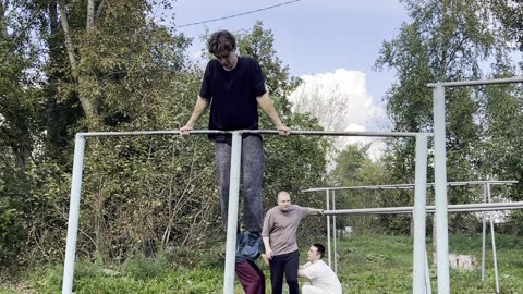 Man Hits His Head Swinging on a Metal Bar