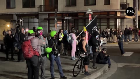 About a dozen "legal observers" with the leftist National Lawyers Guild (NLG) are outside