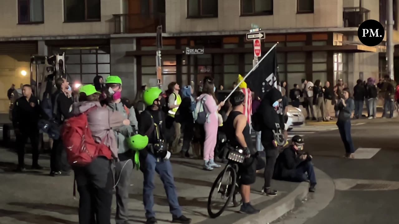 About a dozen "legal observers" with the leftist National Lawyers Guild (NLG) are outside