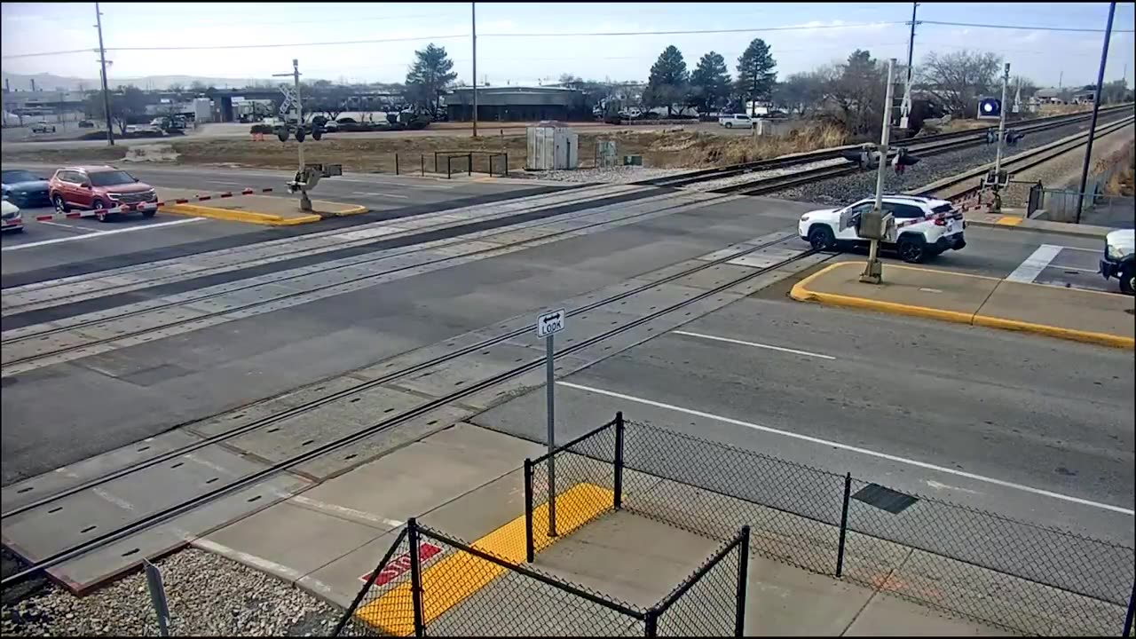 Driver jumps out of SUV moments before a train slams into it in Layton, Utah.