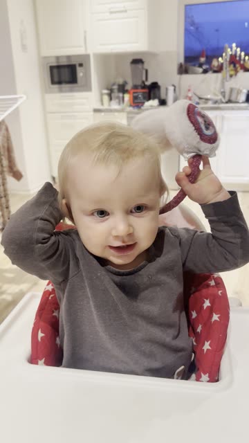 Baby Kayla Holding Earmuffs 🎧😊 (So Joyful!)