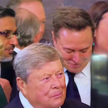 Elon Musk reacting to memes on his phone