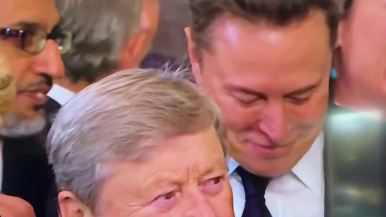 Elon Musk reacting to memes on his phone