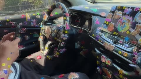 Girl Puts Stickers Everywhere