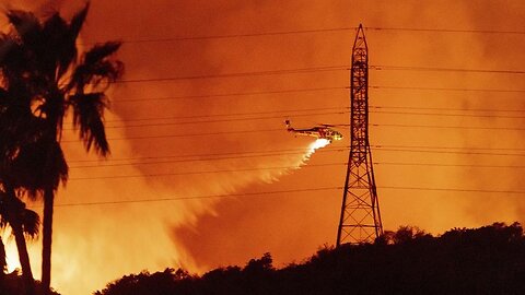 Helicopters battle flames as Palisades Fire burns on Santa Monica Mountains