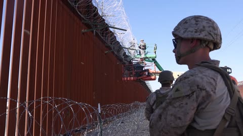 Joint Task Force-Southern Border Marines prep concertina wire for installation (B-Roll)