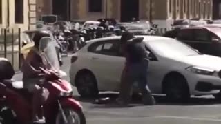 Migrant tries to snatch a purse from an Italian woman but he picked the wrong one
