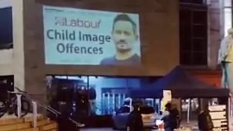Portable projector letting everyone know who the uk government are