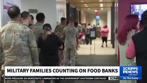 The line at this food bank is filled with military families who have no idea when they'll