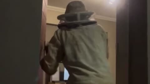 Beekeeper Wielding Trident Faces Bat