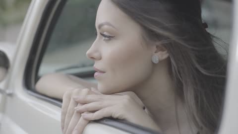 Beautiful Women Starring from Car Window