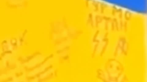 Zelensky caught doing a speech in front of SS nazi insignia by Ukrainian soldiers