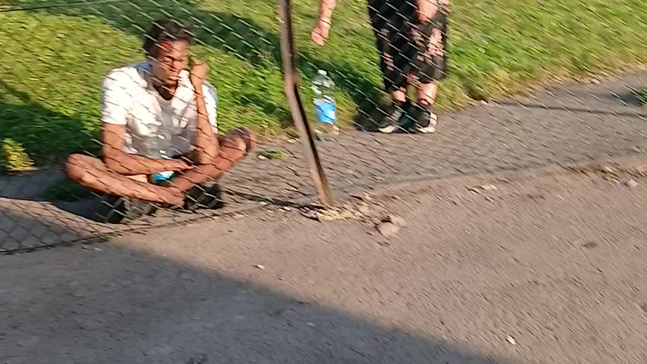 Black mungos man at fence pretending to be a friend visiting