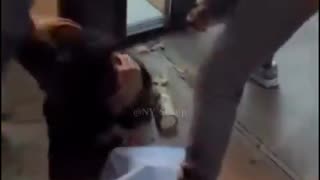 Serial spitter Anthony Caines on the receiving end of some “street-style justice.”