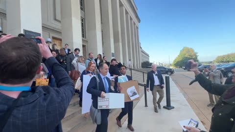 Journalists hand over badges and walk out of the Pentagon after refusing new press access