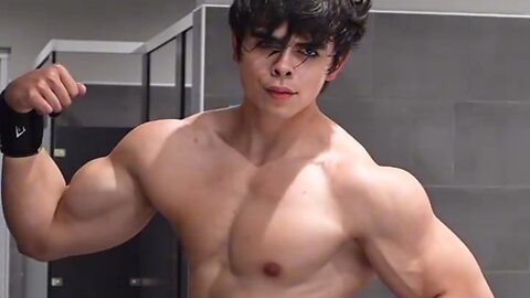 Young muscular man flexing muscles