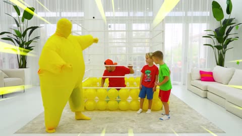 Chris and his friends play with balloons and toys.