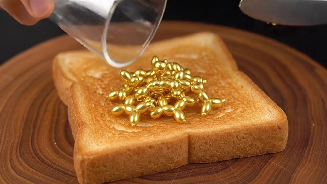 Spreading golden objects on toast #asmr #whichonewouldyoupick #asmrsounds #oddlysatisfying