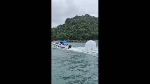 Boaters Rescue Boy Floating In Inflatable Plastic Bubble