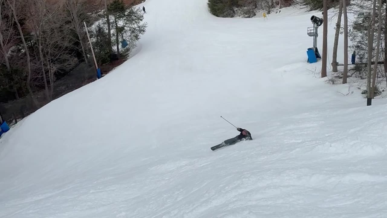 Skiing Father Still Sliding Down Slope