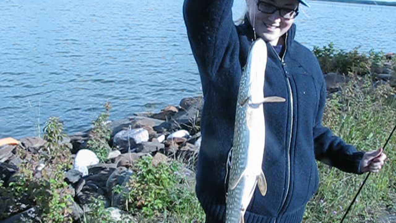 Sara Catching Pike on Brazue Dam 2010