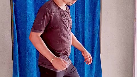 The cat is copying the man's dance