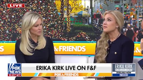 Phony Erika Kirk with more Gold on her fingers than Fort Knox