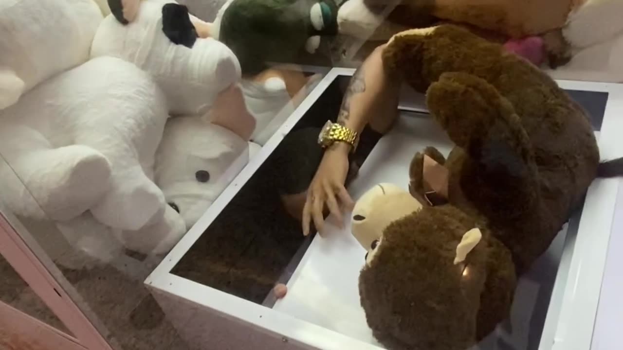 Man Climbs Into Claw Machine to Take His Prize