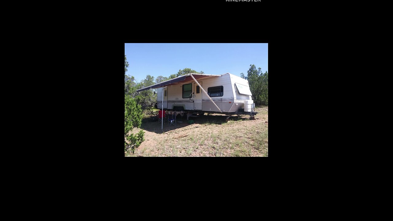 Driving up the side of a mountain to place RV on property
