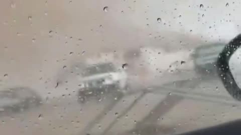 Tornado tears through parking lot, partially damages building in Gautier, Mississippi.