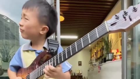 Meet Maituo, a 10-year-old who plays the guitar like a blues legend