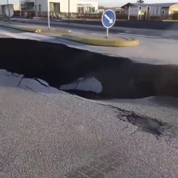 🔥🔥🔥 A massive sinkhole, has suddenly appeared on a road. Location in Europe yet to be confirmed.