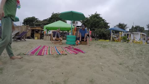 Family time on the beach in Puerto Lopez, Ec
