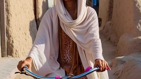 Muslim girl wearing ride a cycle in an Pakistan village