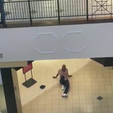 Dude jumps off 2nd floor trying to get away