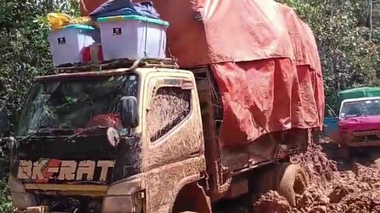 queue of trucks stuck on extreme roads