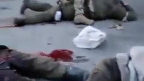 Additional angle of Ukrainian soldiers torturing Russian prisoners.