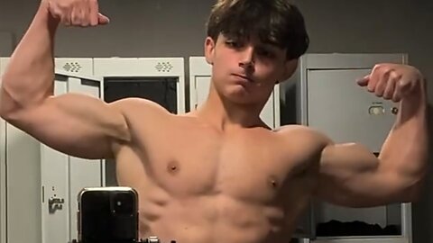 18 years old teen bodybuilder flexing muscles