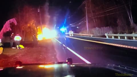 New Jersey police department shows 2 of its officers rescuing an unconscious man from a burning car