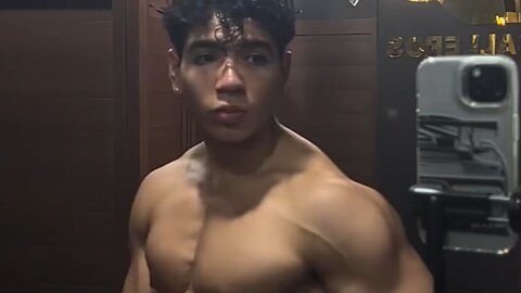 Handsome muscular man showing off his muscles