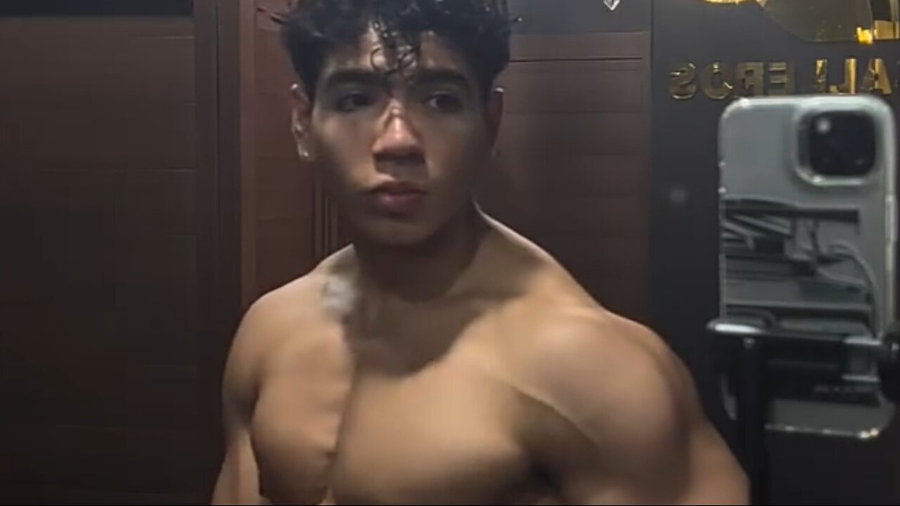 Handsome muscular man showing off his muscles