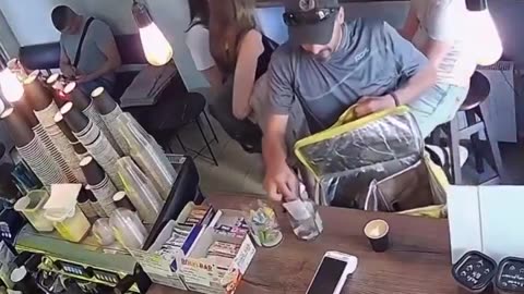 Delivery driver steals from tip jar. Caught on camera.