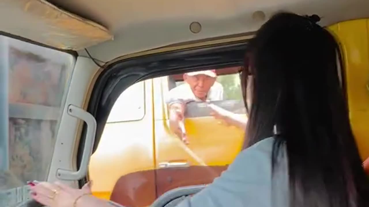 female truck driver carrying sand