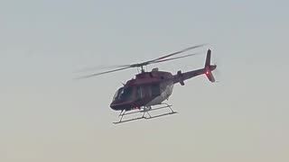 the stunning Bell 407 medical helicopter at sunset