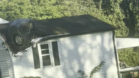 Car Crashed Vertically Through Home's Roof
