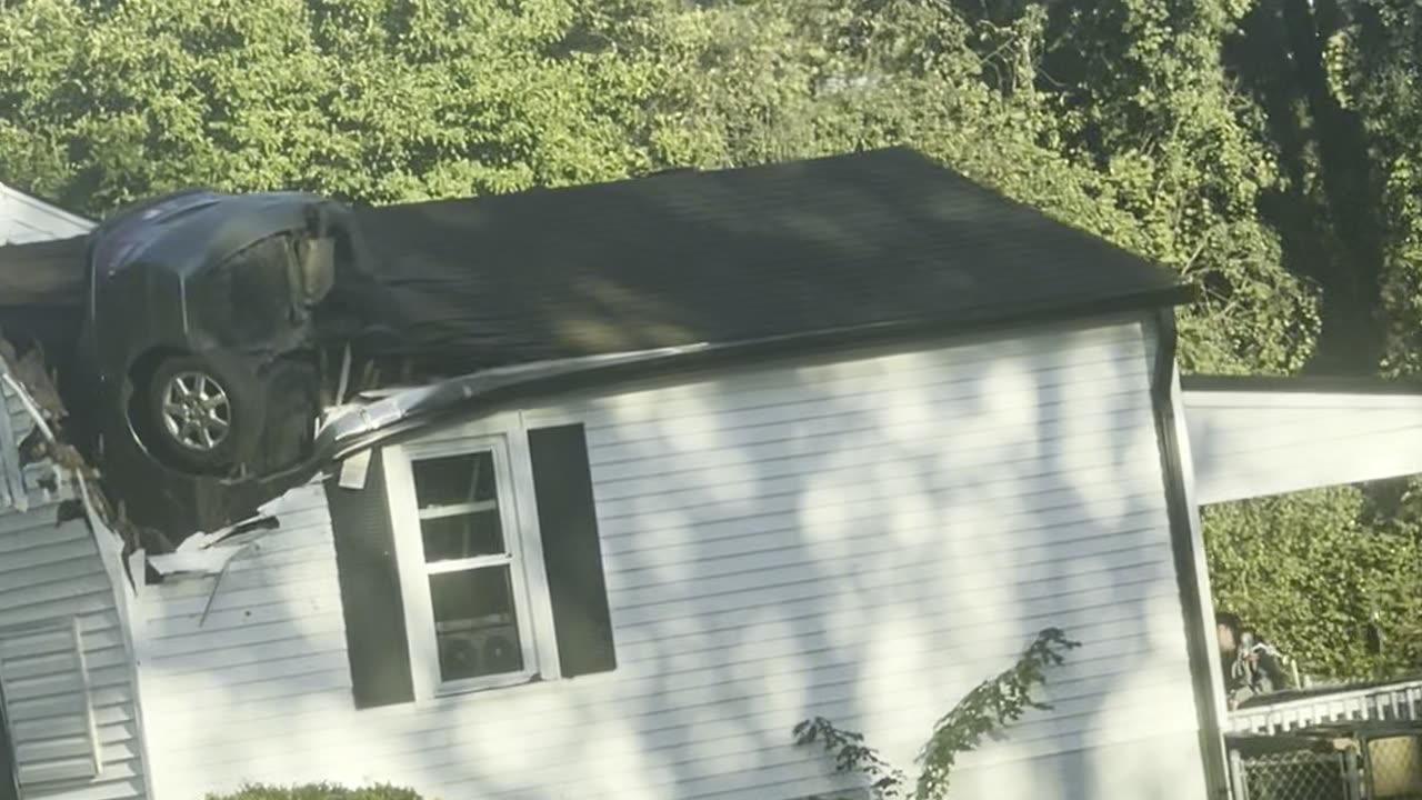 Car Crashed Vertically Through Home's Roof